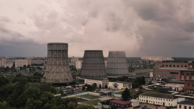 Smoke from chimneys of thermal power plant oe station, aerial view from drone