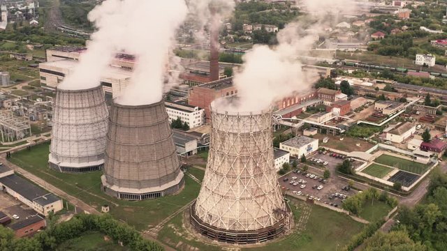 Smoke from chimneys of thermal power plant oe station, aerial view from drone