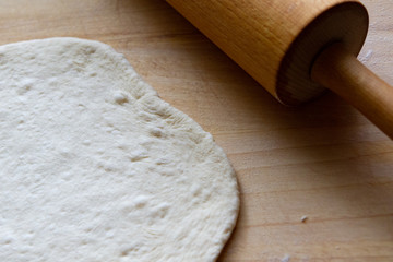 preparation of a dough for baking on a chopping board - preparing Slovakian steamed buns