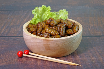 Edible insects : Deep fried crispy salted Silkworm pupae.  Entomophagy : Edible insects, other natural sources of nutrients. Famous street food in Thailand.