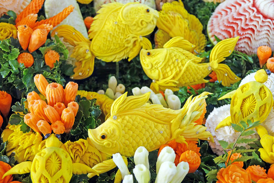 Beautiful Thai style carving fruits and vegetables in fish among sea anemones shaped. Royal Thai cuisine decorative style. Selective focus