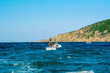 Small traditional fishing boat in the sea
