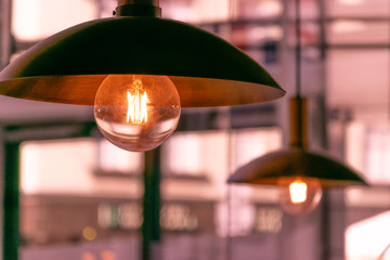Light, design and interior. Vintage metallic lantern in cafe.