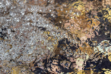 Water bubbles and ripples on a fountain, close-up