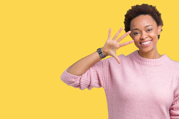 Beautiful young african american woman over isolated background showing and pointing up with fingers number five while smiling confident and happy.