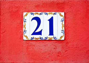 Number 21 / twenty-one, decorative tiles number on the wall.