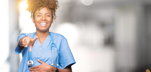 Young african american doctor woman over isolated background Laughing of you, pointing to the...