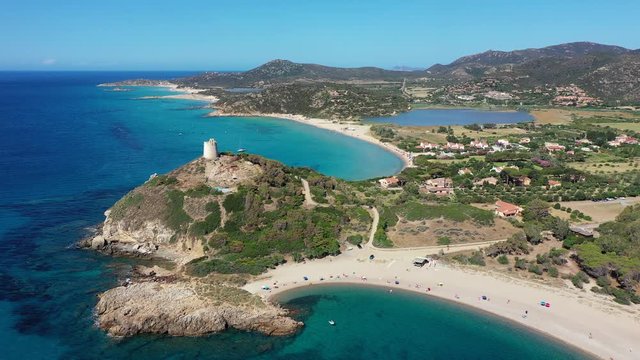 View from flying drone. Astonishing summer view of popular tourist destination, Acropoli di Bithia with Torre di Chia tower on background. Aerial morning view of Sardinia island, Italy, Europe.