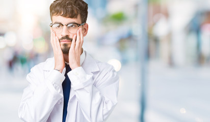 Young professional scientist man wearing white coat over isolated background Tired hands covering face, depression and sadness, upset and irritated for problem