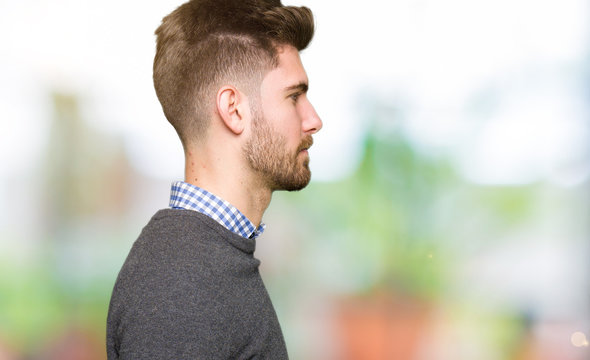 Young handsome elegant man looking to side, relax profile pose with natural face with confident smile.