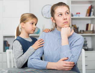 Little daughter soothe mom after an quarrel