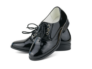 Fashionable black women's patent leather shoes isolated on white background.