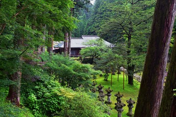 Traditional Japanese gardens in public parks in Tokyo, Japan. Views of stone lanterns, lakes,...