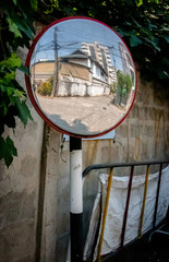 Reflection in concave lens mirror. Street or Traffic Concave Mirror. Image formed by concave mirror is generally real and inverted.