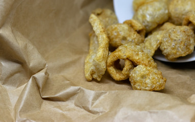 Crispy pork crackers. Thai food or snack made from pork skin, seasoned with salt or soy sauce and Fried with hot oil until crispy.