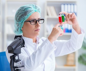 Female scientist researcher conducting an experiment in a labora