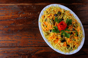 Salpicao is a typical Brazilian salad, made with shredded chicken, raisin, grated carrot, potato sticks and mayonnaise.