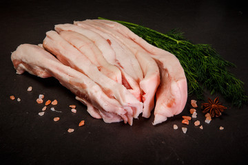 long pieces of pork fat served with spices and green dill