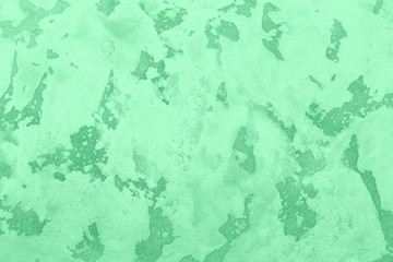 Rough grunge wall background. Trendy Mint color