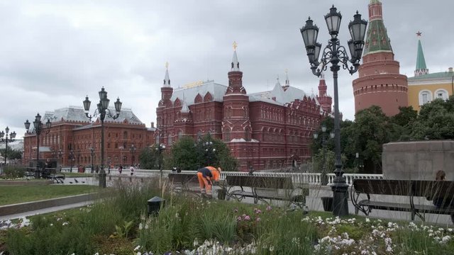 MOSCOW, RUSSIA - AUGUST 1, 2019: Uglovaya Arsenal'naya Bashnya and State Historical Museum by Red Square. gardener working