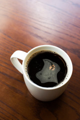American black coffee on wooden table