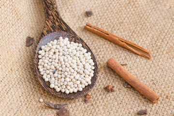 pepper white and wood spoon