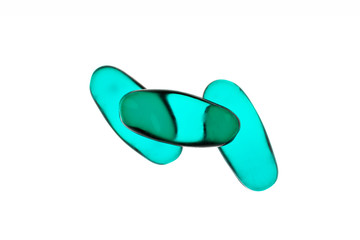 Bad shape expired blue pills on background