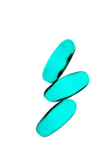 Bad shape expired blue pills on background