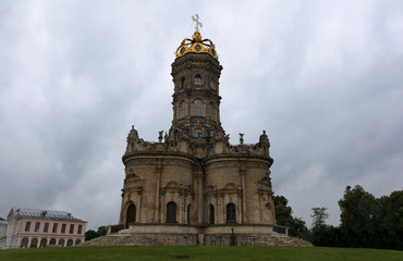 Fototapeta premium An unusual Christian church in the Moscow region. Church of Our Lady of the Sign (Znamenskaya church) in Dubrovitsy. Podolsk district. Russia. Toning in ретро style filters. Style vintage postcards.
