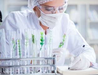 Female scientist researcher conducting an experiment in a labora