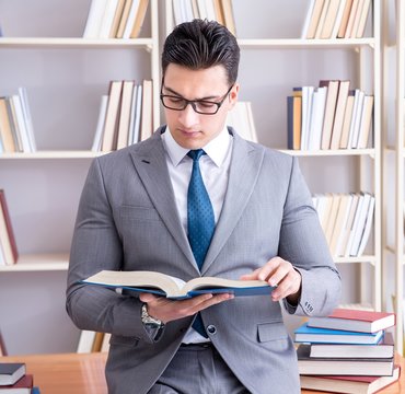 Business Law Student Working Studying In The Library