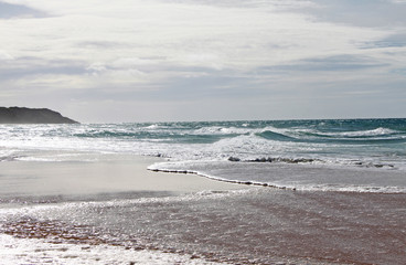Wave shapes on the beach at Lake Tyers. Australia.