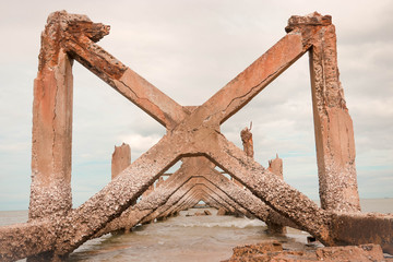 Breaking port Cement columns on piers are constantly corroded.