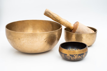 Flat lay composition of Ancient hand crafted traditional Tibetan meditation and healing singing bowls made from 7 sacred metals which are typical accessories used in buddhism, yoga and meditation