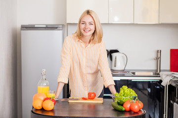 Young woman cooking in the kitchen