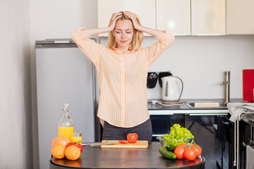 Young woman cooking in the kitchen