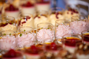 Colorful and Decorative Desserts And Pastry with fruits, mousse, biscuits Served On A Wedding Party