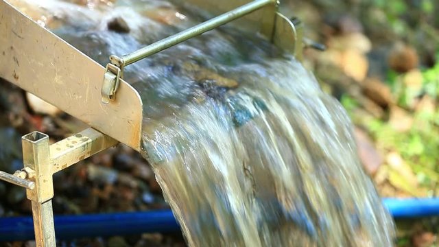 Handheld shot of Sluice Box for Gold Panning - Shallow Depth of Field.