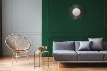Fashionable armchair in trendy living room interior in contemporary apartment