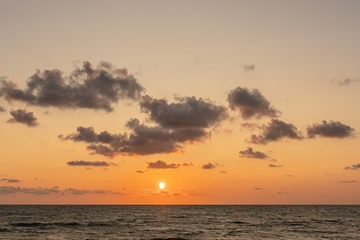 Small heavy low clouds during sunset. Copy space 
