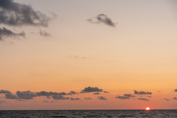 Small heavy low clouds during sunset. Copy space 