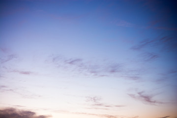 Gray color clouds partly cover the  sky