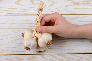 Cloves of garlic in hand  in view