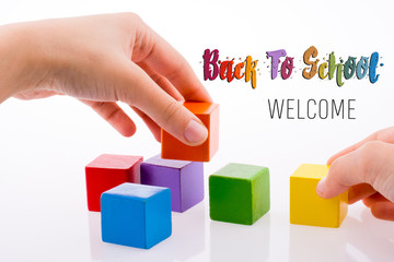 Hand playing with cubes