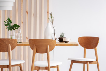 Fashionable scandinavian wooden design in bright living room interior