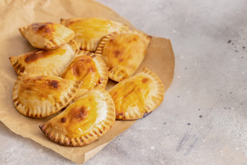 Homemade Spanish Empanadillas, small filling tuna pies. Typical dish in Latin American and Spain cuisine.