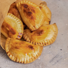 Homemade Spanish Empanadillas, small filling tuna pies. Typical dish in Latin American and Spain cuisine.