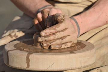 Pottery male ceramist creates a hand made clay product
