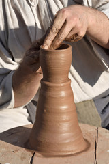 Pottery male ceramist creates a hand made clay product