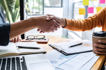 Fototapeta premium business man hands shaking together in office.